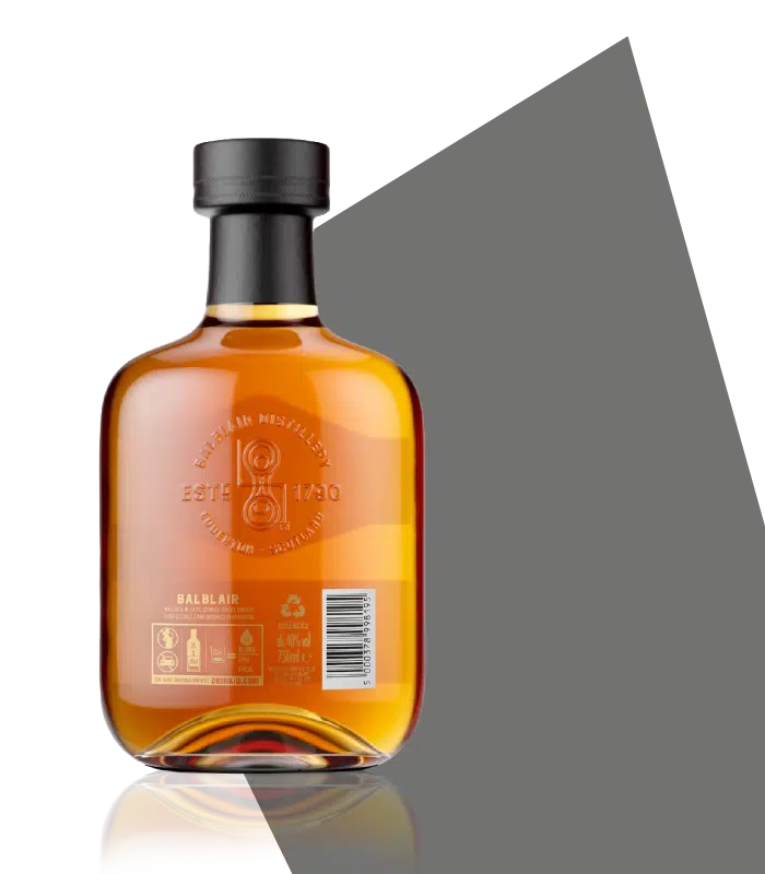 A glass bottle of Balbair with a big dip and broad shoulders