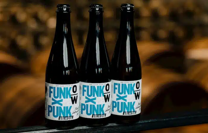 3 FunkxPunk bottles with barrels behind
