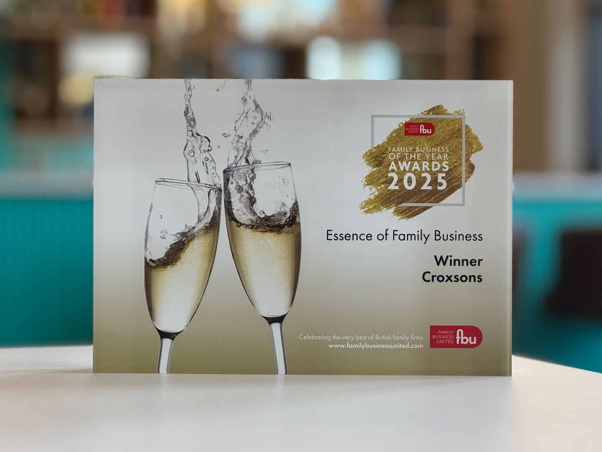 Glass Award 'Essence of family business' on table top