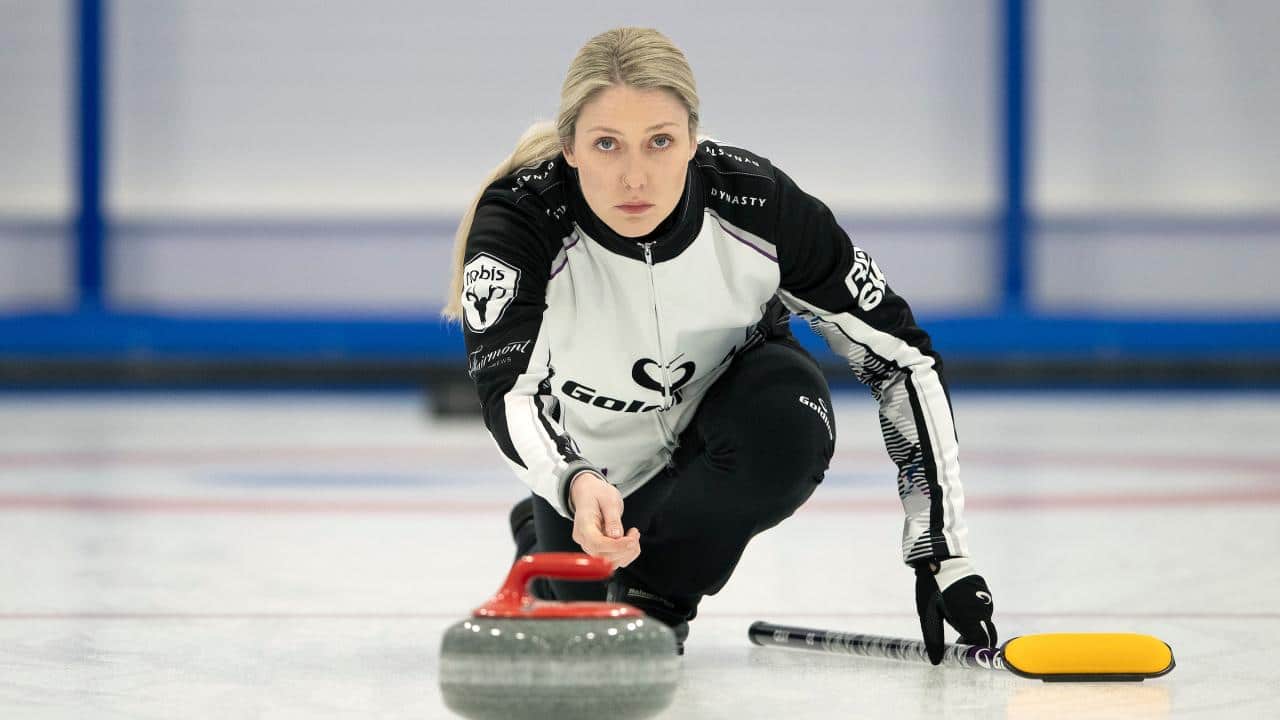 Lauren Gray, curling on ice.